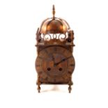 A brass cased striking lantern clock with French movement