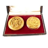 A cased pair of silver gilt seals,