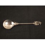 An antique continental silver spoon with crucifixion terminal and early hallmarks,