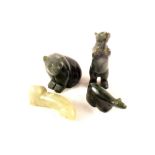 Three Inuit green stone animals plus one other carving