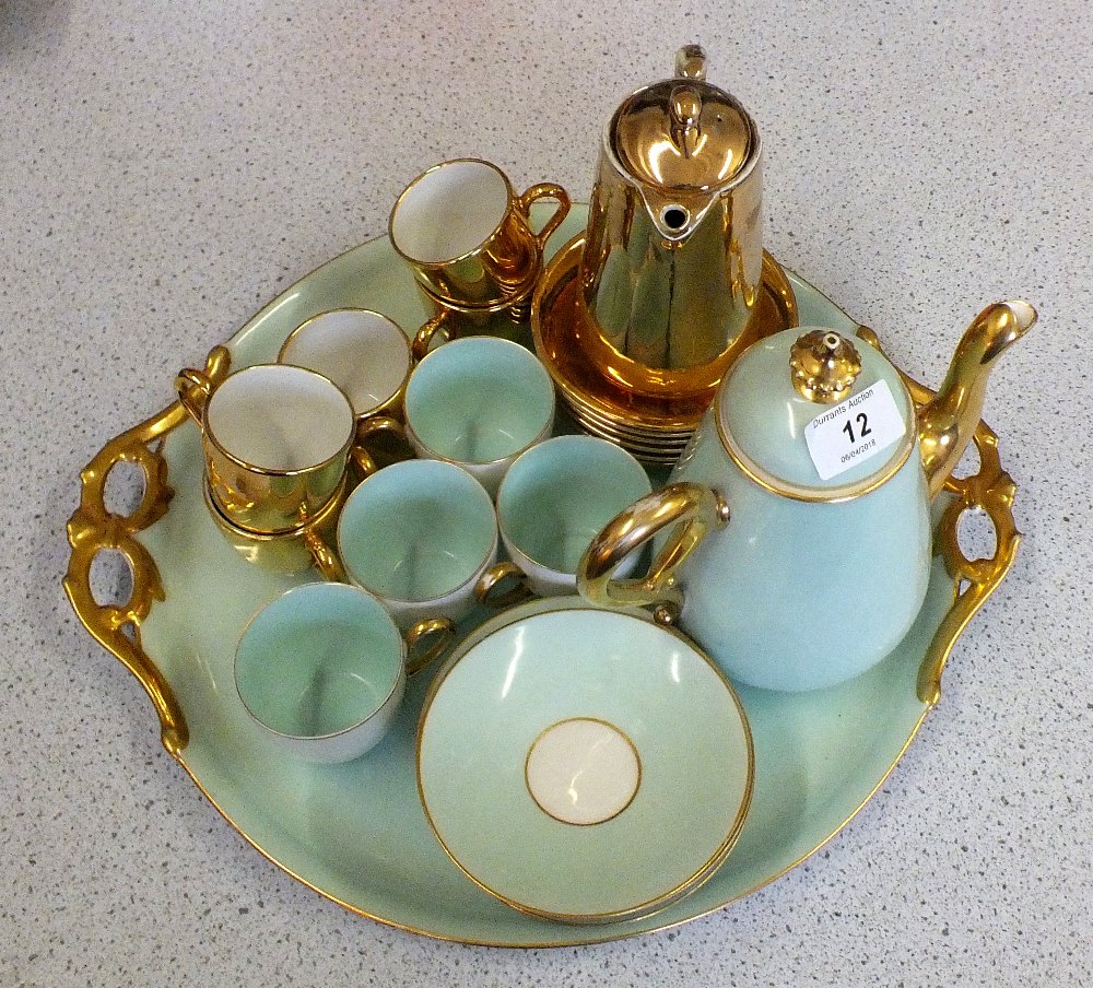 A continental blue and gilt porcelain part Cabaret set plus a gilt part coffee set