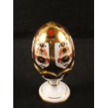 A Royal Crown Derby Japan pattern egg on stand (boxed),