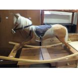 A modern bespoke wooden rocking horse