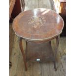 A shaped top inlaid occasional table with under tier and gilt metal decoration,