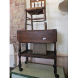 An oak flap leaf tea trolley with under tier, on later castors,