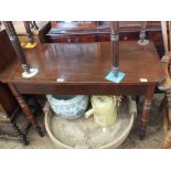 A Victorian mahogany hall table on turned legs