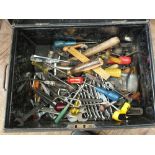 A small tin trunk containing a wide variety of tools