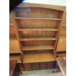 A Nathan teak shelf back to door cupboard bookcase