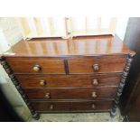A Victorian mahogany chest of two short and three long drawers flanked by turned columns