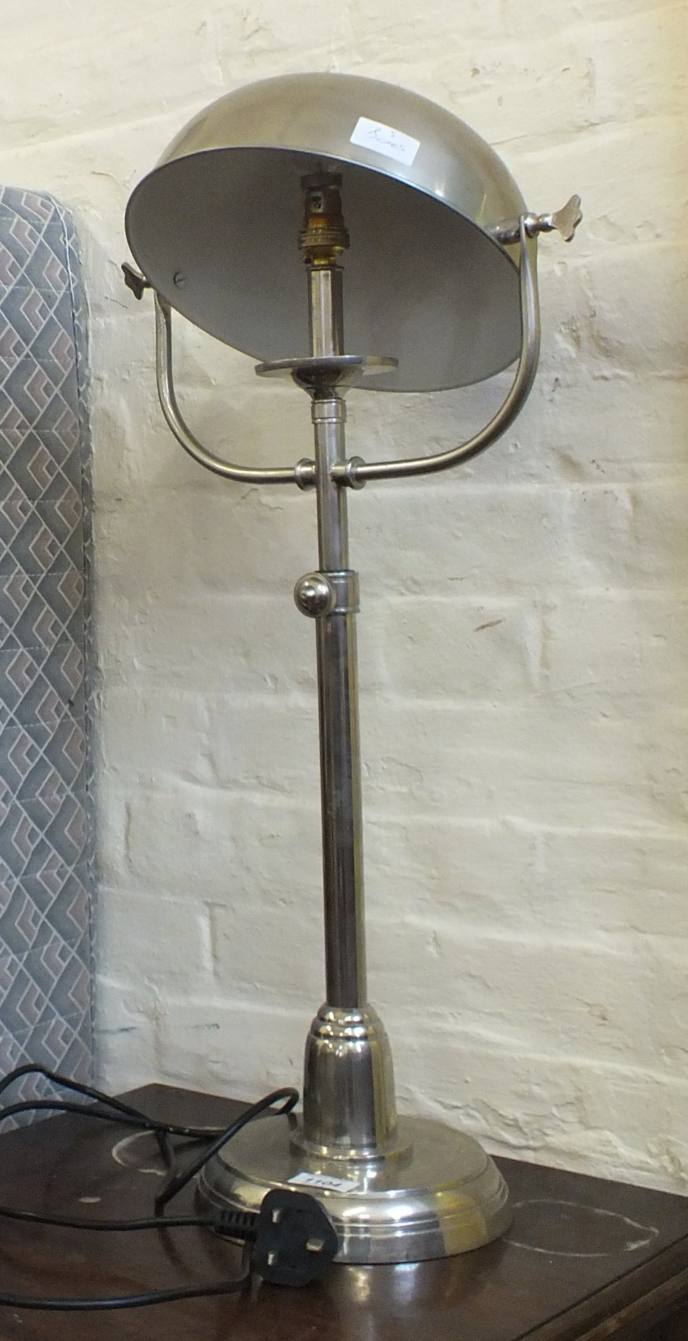 An chrome adjustable student's lamp