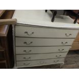 A cream and gilt painted French style wardrobe and matching chest of five drawers