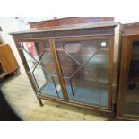 A mahogany glazed display cabinet with astral glazed doors and two internal glass shelves