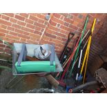 A selection of garden tools and an aluminium wheel barrow