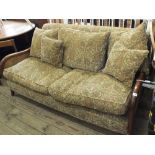 A modern Multiyork three seater sofa with bergere ends with cream and gold thistle design