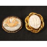 A gold mounted cameo brooch with drinking bird carving plus a gold plated cameo brooch