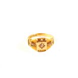 An 18ct gold ring set with three small diamonds,