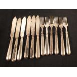 A set of six silver knives and forks,