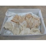 A box of various lace work to include dresses,