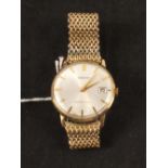 A gents 9ct gold Seiko wristwatch with round dial on gold plated non-Seiko bracelet