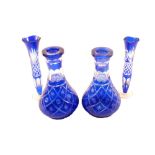 Two pairs of Bohemian blue overlaid glass vases