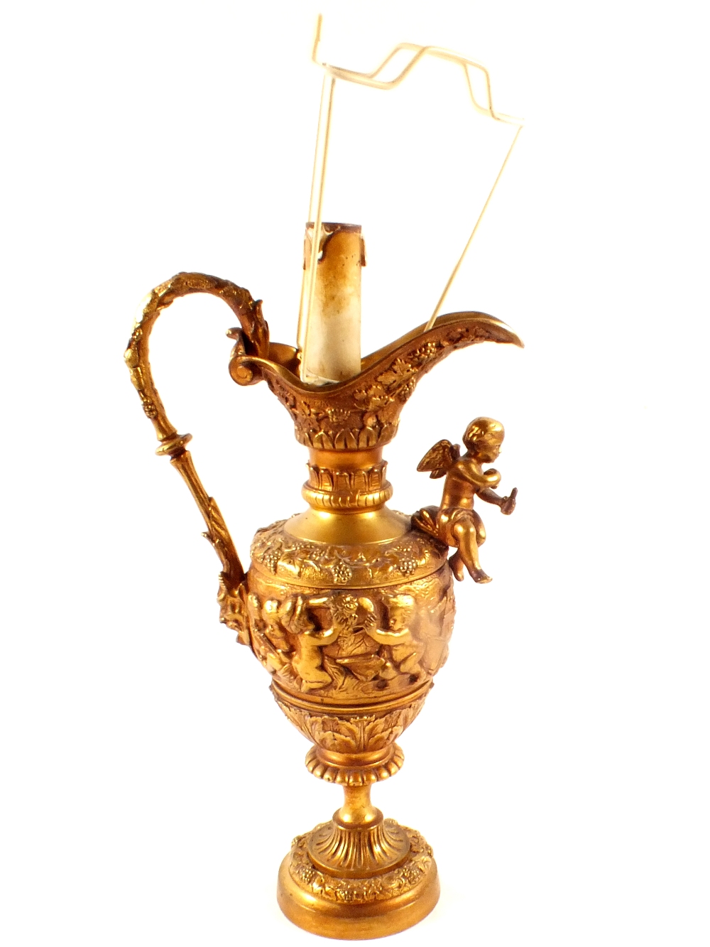 A brass ewer table lamp with cherub decoration