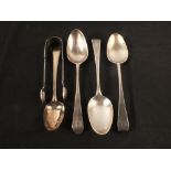 Four Georgian silver serving spoons, three with monogram,