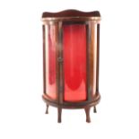 A miniature mahogany bow front china cabinet