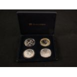 A cased 'The 2006 Famous World Silver Coin Collection' comprising of United States eagle,