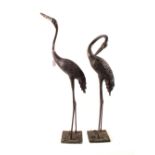 A pair of Japanese bronzed standing cranes,