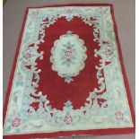 A Chinese floral rug plus one other