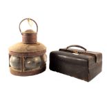 A copper ships lamp plus a leather doctors bag