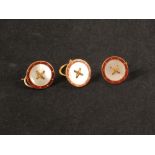 Three 9ct gold shirt studs with mother of pearl and red enamel decoration