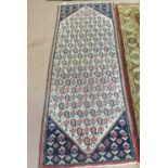 A Persian runner with multiple boteh motifs,