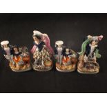 Four Victorian Staffordshire figure groups (some as found)