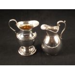 Two silver cream jugs,