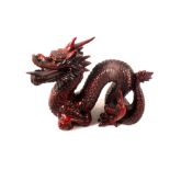 A Chinese red moulded dragon