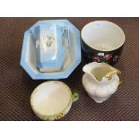 A blue bird and floral toilet jug and bowl plus other toilet wares and a black rose decorated