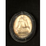 An oval scrimshaw picture of sailing ship The Amphion,