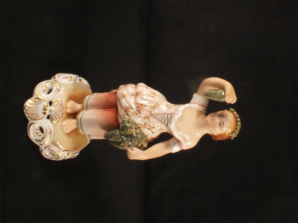 A Royal Crown Derby figurine,