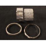 Four silver and white metal bangles/cuffs