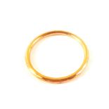 A 9ct gold hollow faceted slave bangle