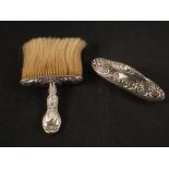 A silver embossed blotter and a silver embossed brush