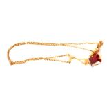 A 9ct gold pendant set with rectangular red stone on fine 9ct gold chain