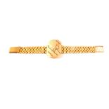 A 9ct gold ski bracelet for Peter Howell,