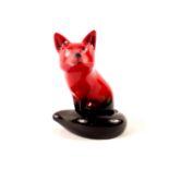 A Royal Doulton Flambe seated fox,