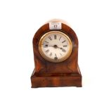 A walnut cased mantel clock