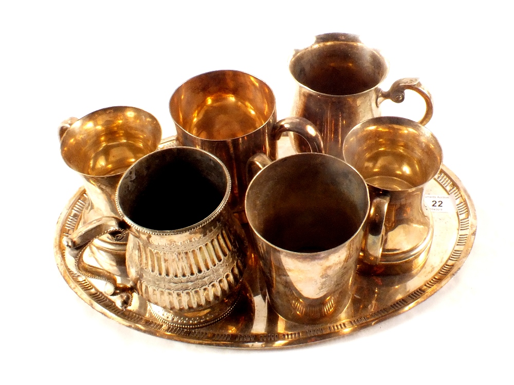 An oval silver plated tray plus six tankards