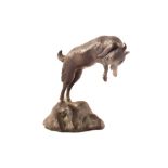 A bronze leaping goat,