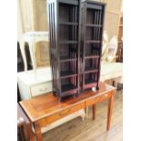 A pair of modern narrow CD racks and a mahogany hall table with two faux drawers