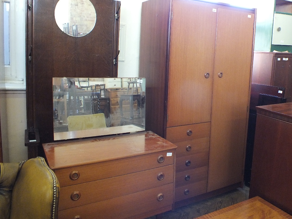 A 1970's teak dressing table and combination wardrobe